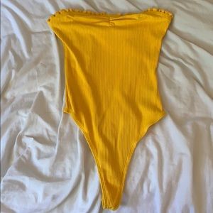 Yellow body suit
